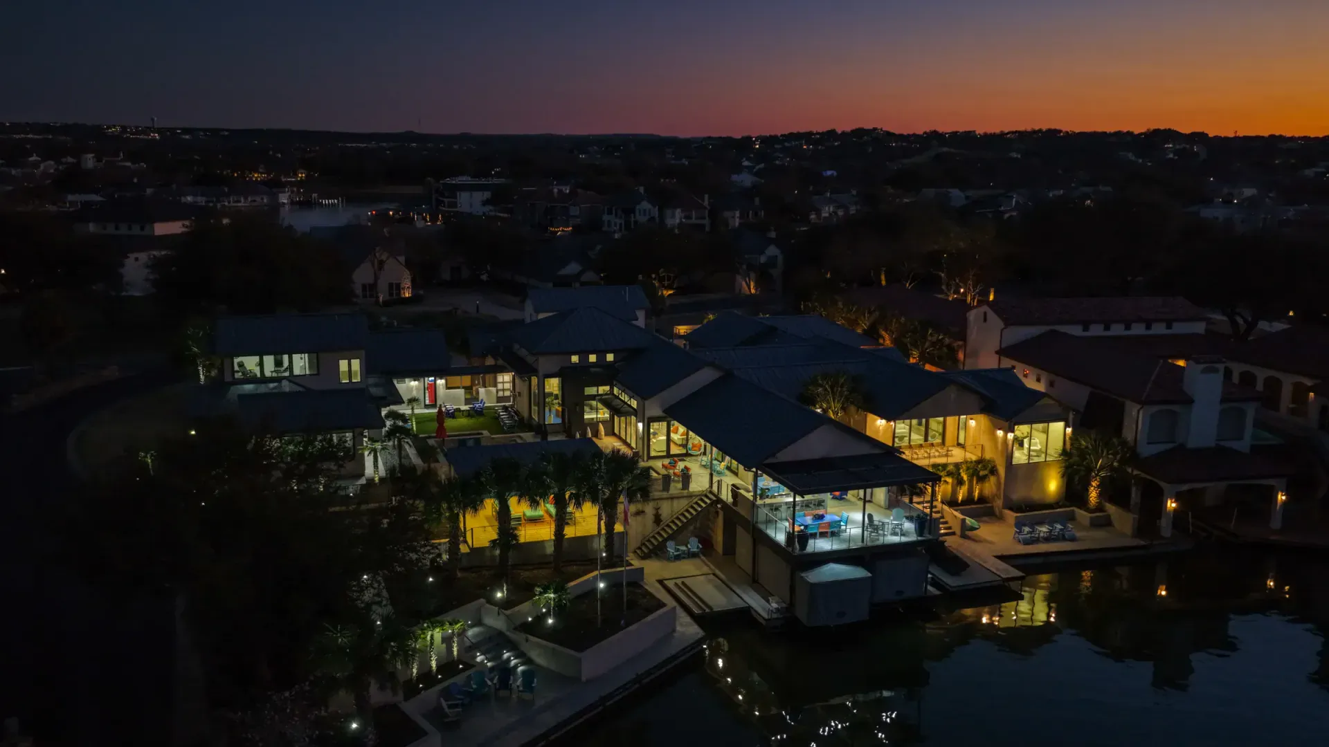 Aerial night view of full property with pool